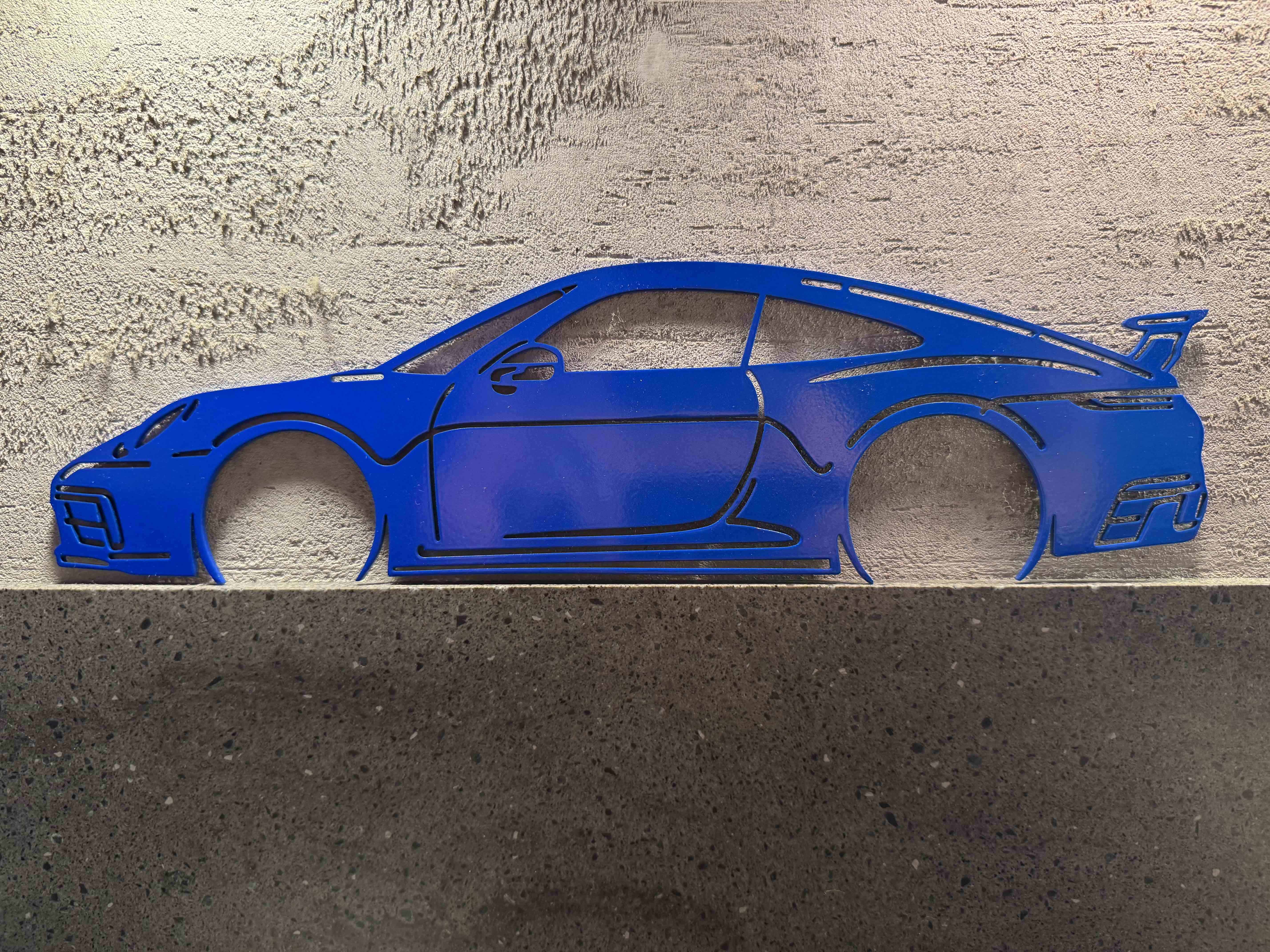 Porsche 992 GT3 синий на бетоне
